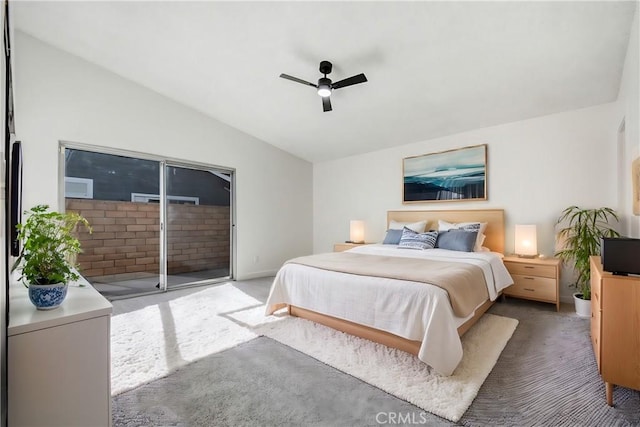 carpeted bedroom with ceiling fan, access to exterior, and vaulted ceiling