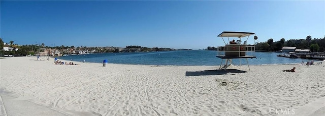 property view of water featuring a beach view