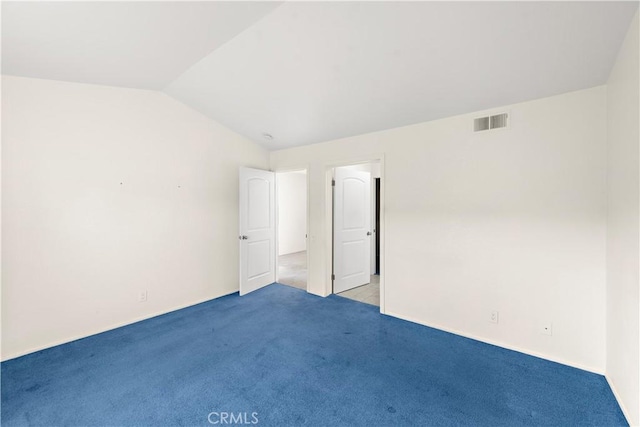 unfurnished room with light colored carpet and lofted ceiling