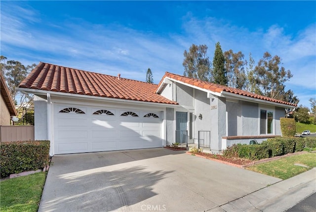 mediterranean / spanish-style house featuring a garage