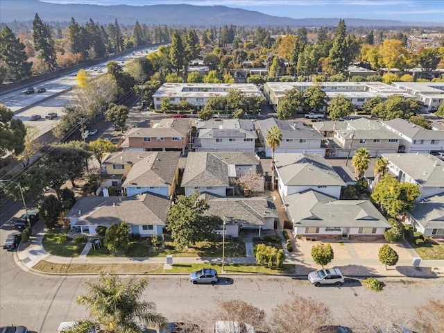 birds eye view of property with a mountain view