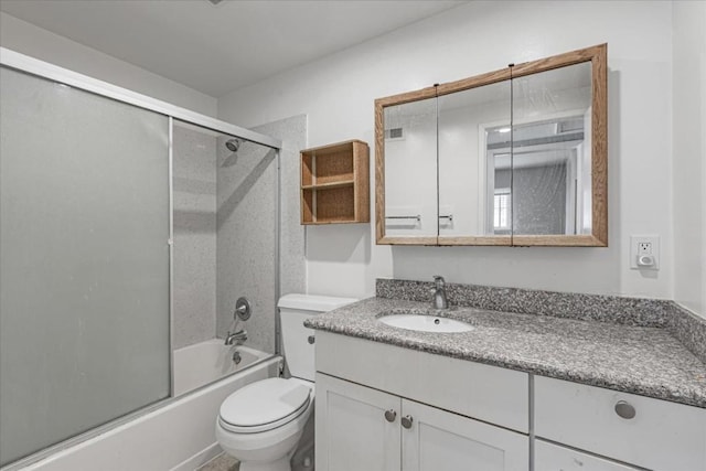 full bathroom with toilet, vanity, and shower / bath combination with glass door