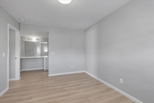 spare room featuring light hardwood / wood-style floors