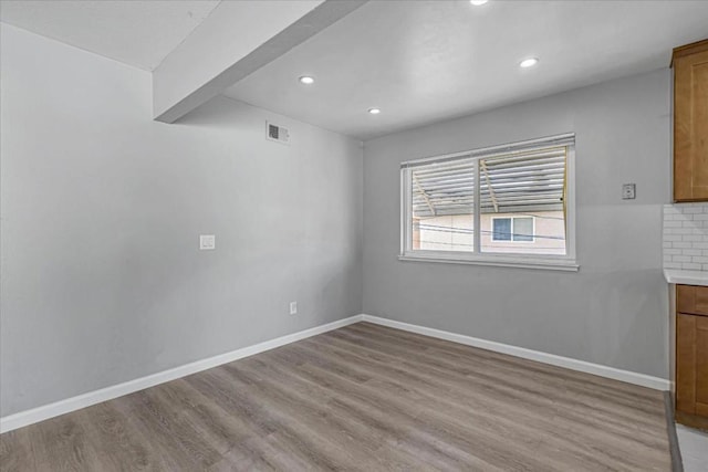 unfurnished dining area featuring light hardwood / wood-style floors