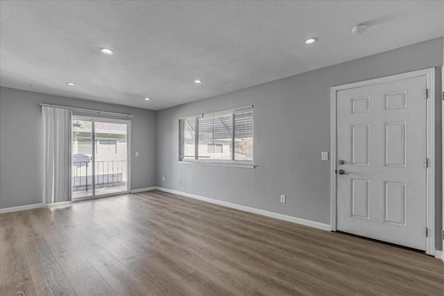 spare room featuring hardwood / wood-style flooring