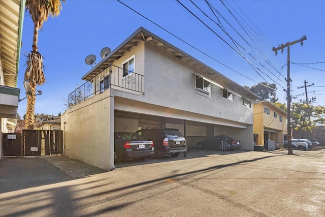 view of side of property featuring a balcony