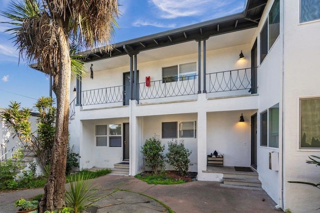 view of front of property with a balcony