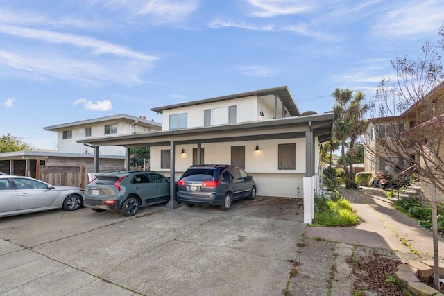 front facade with a carport