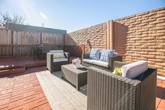 view of patio / terrace with outdoor lounge area and a deck