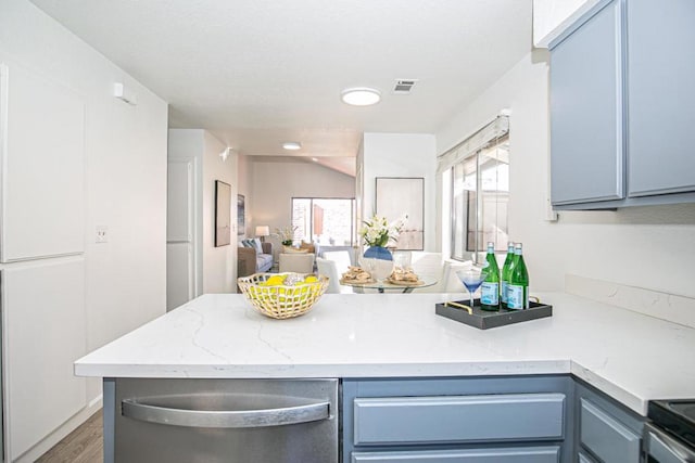 kitchen with dark hardwood / wood-style flooring, stainless steel range with electric stovetop, and blue cabinets