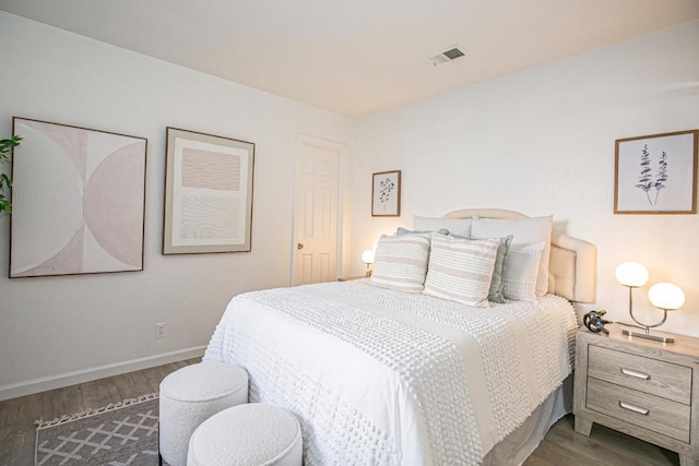 bedroom featuring dark wood-type flooring