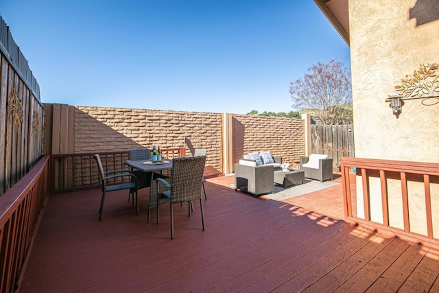 wooden deck featuring outdoor lounge area