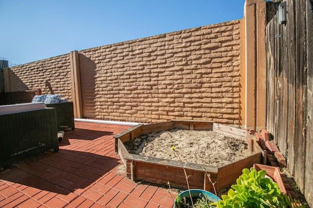 wooden terrace featuring a patio area