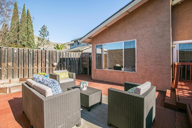 wooden deck featuring an outdoor hangout area