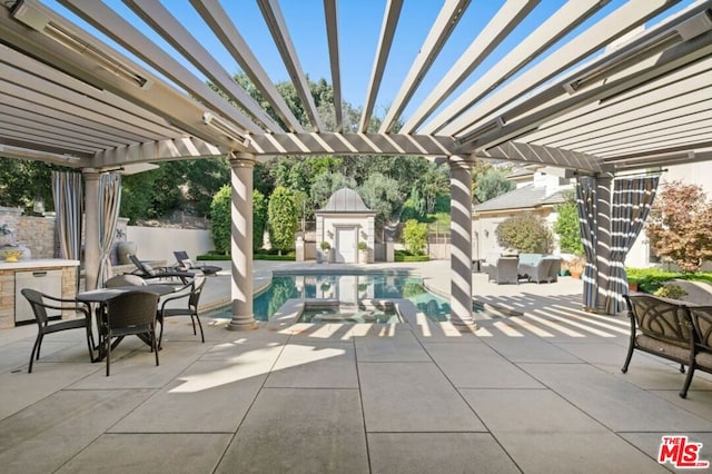 view of patio / terrace with a pergola and a fenced in pool