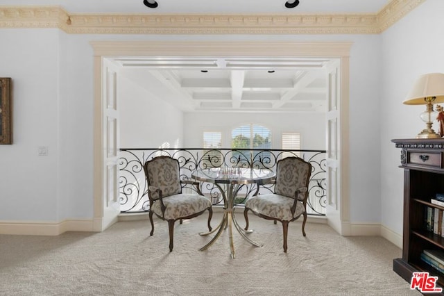 living area featuring ornamental molding and carpet flooring