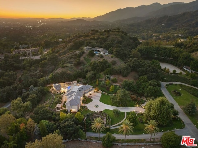 aerial view at dusk with a mountain view