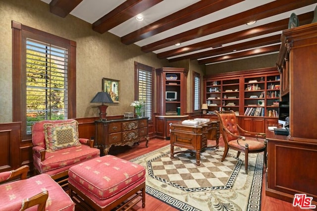 office featuring beam ceiling and light hardwood / wood-style flooring