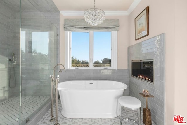 bathroom featuring tile patterned flooring, tile walls, crown molding, and plus walk in shower