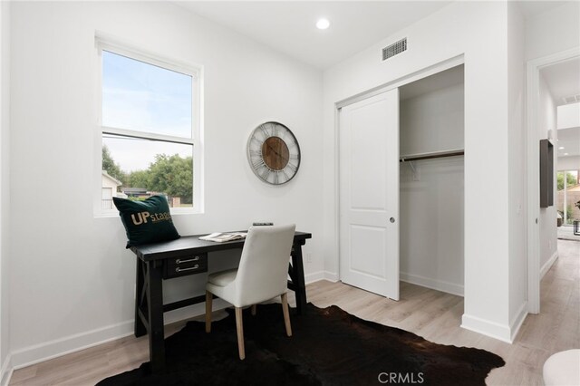 office area featuring a wealth of natural light and light wood-type flooring