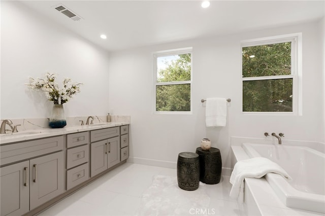 bathroom featuring vanity and a bathing tub