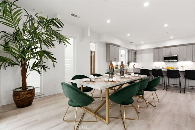 dining room with light wood-type flooring