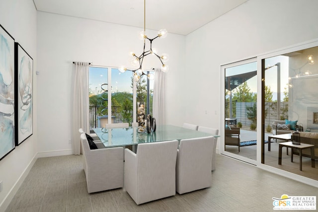 dining space featuring a notable chandelier