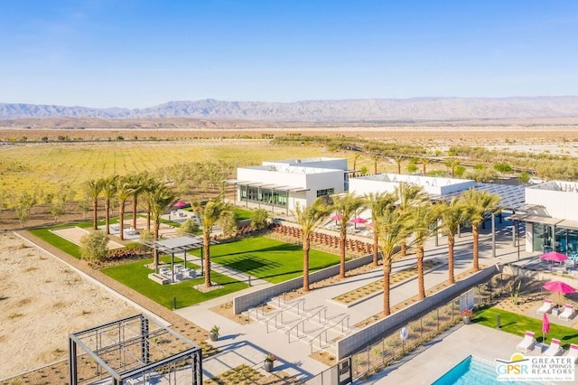 birds eye view of property with a mountain view