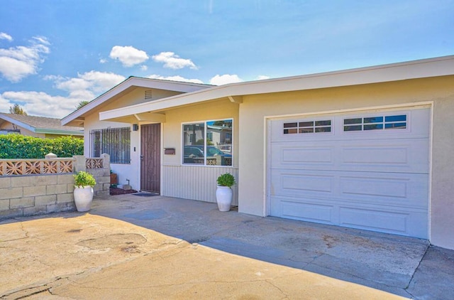 ranch-style house featuring a garage