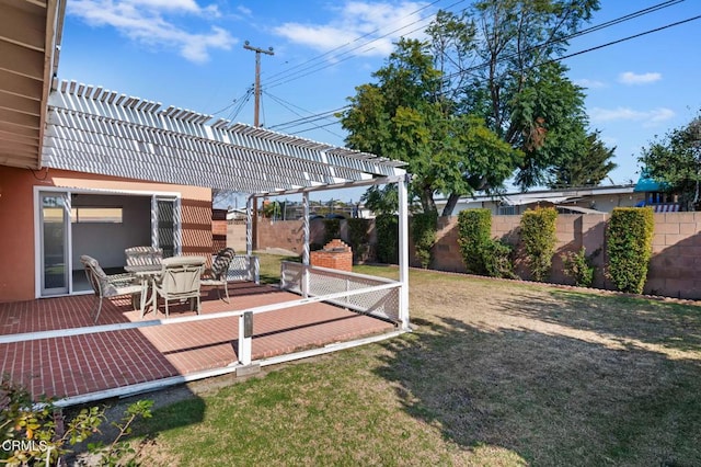 view of yard with a pergola and a fireplace