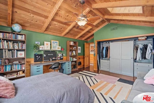 bedroom featuring wooden ceiling, a closet, and lofted ceiling with beams