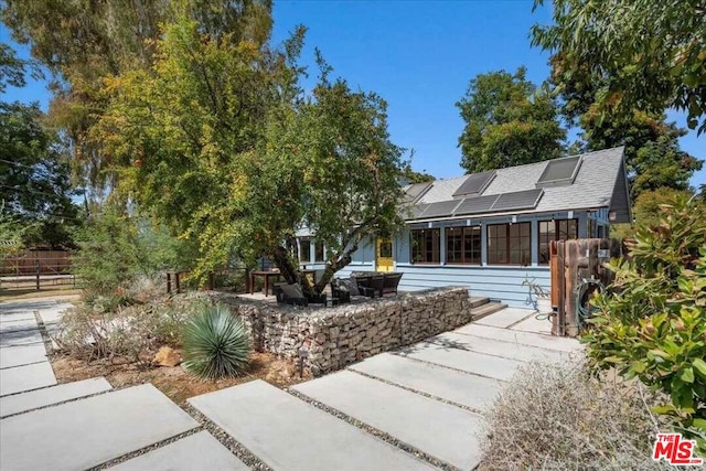 view of front of house with solar panels