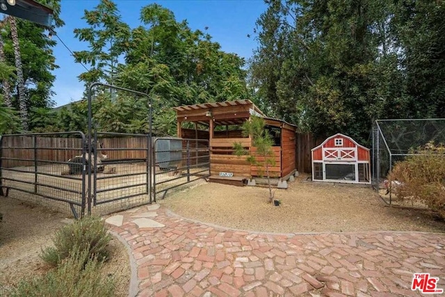 view of patio / terrace with an outdoor structure