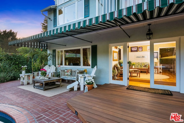 view of patio terrace at dusk