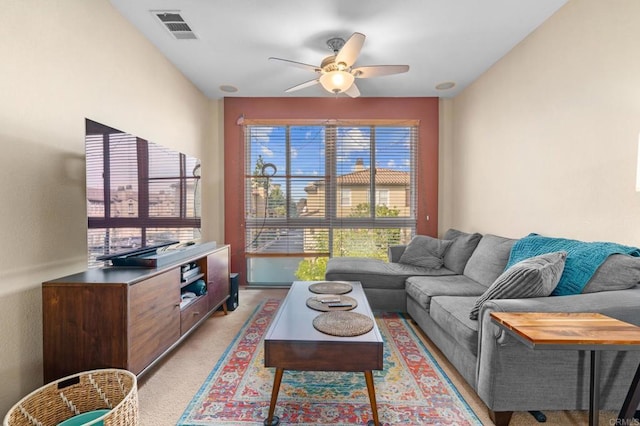 living room featuring ceiling fan and light carpet