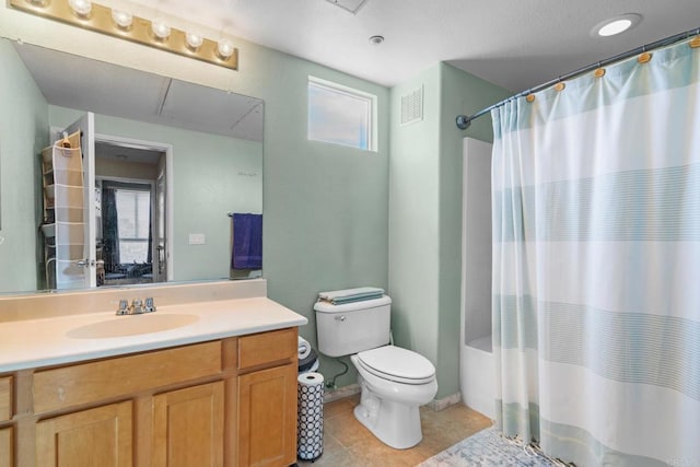 full bathroom with toilet, a healthy amount of sunlight, vanity, and shower / tub combo with curtain