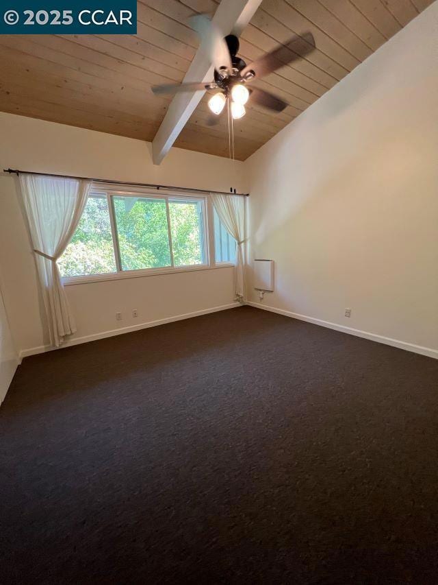 carpeted spare room with ceiling fan, wooden ceiling, and vaulted ceiling with beams