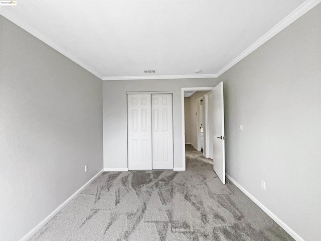 unfurnished bedroom with a closet, ornamental molding, and light carpet