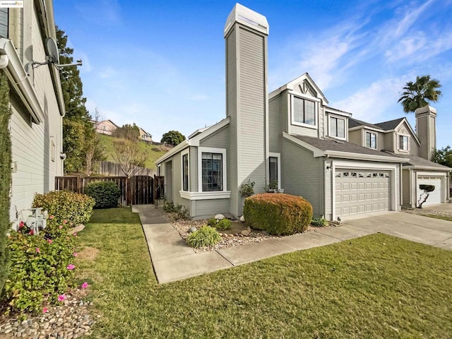 view of home's exterior with a garage and a yard