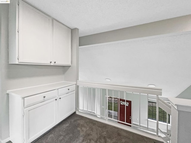 interior space featuring a textured ceiling