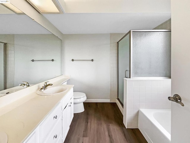 full bathroom with vanity, toilet, wood-type flooring, and plus walk in shower