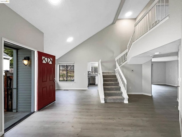 entryway featuring hardwood / wood-style floors and high vaulted ceiling