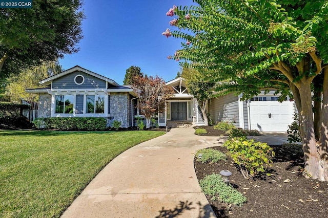 view of front facade with a garage and a front lawn