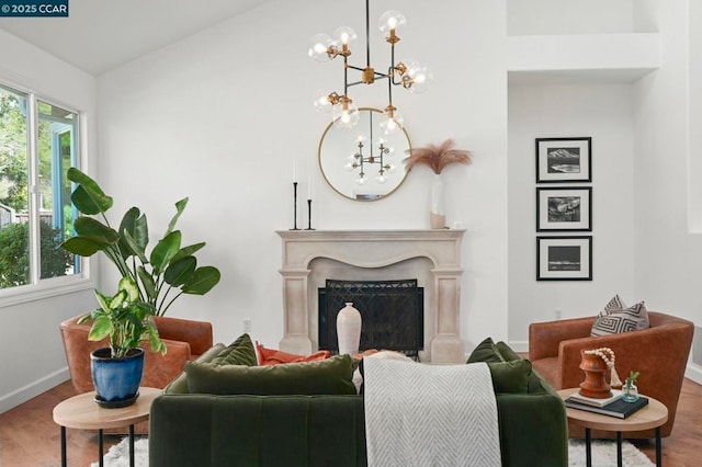 living room featuring an inviting chandelier and hardwood / wood-style flooring