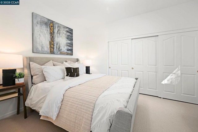 carpeted bedroom with a closet