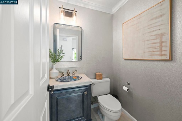 bathroom featuring crown molding, vanity, and toilet