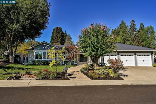 ranch-style house with a garage and a front lawn