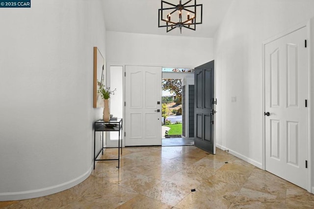 entryway featuring a notable chandelier