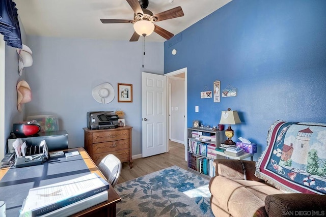 interior space featuring ceiling fan and light wood-type flooring