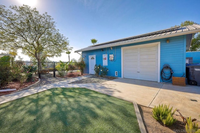 ranch-style house with a garage and a front yard